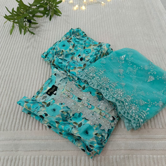 Turquoise fabric with floral and embroidered patterns on a light background
Celebrate Eid with Noor-e-Zar Collection - Flat 25% Off Festive Pakistani Dresses Online
